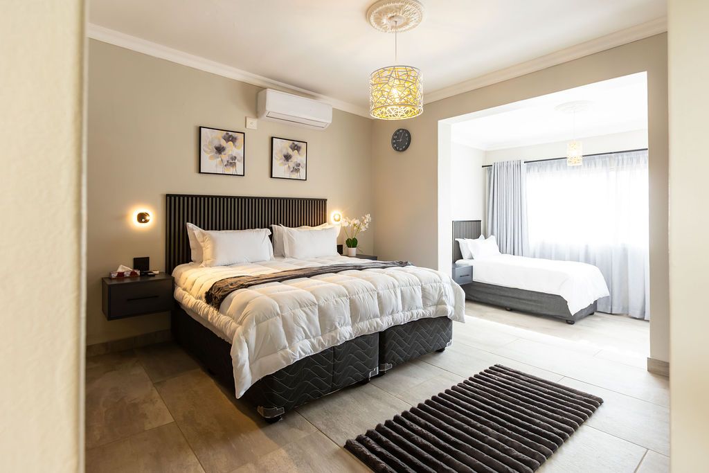 Family room with a double bed and a single bed